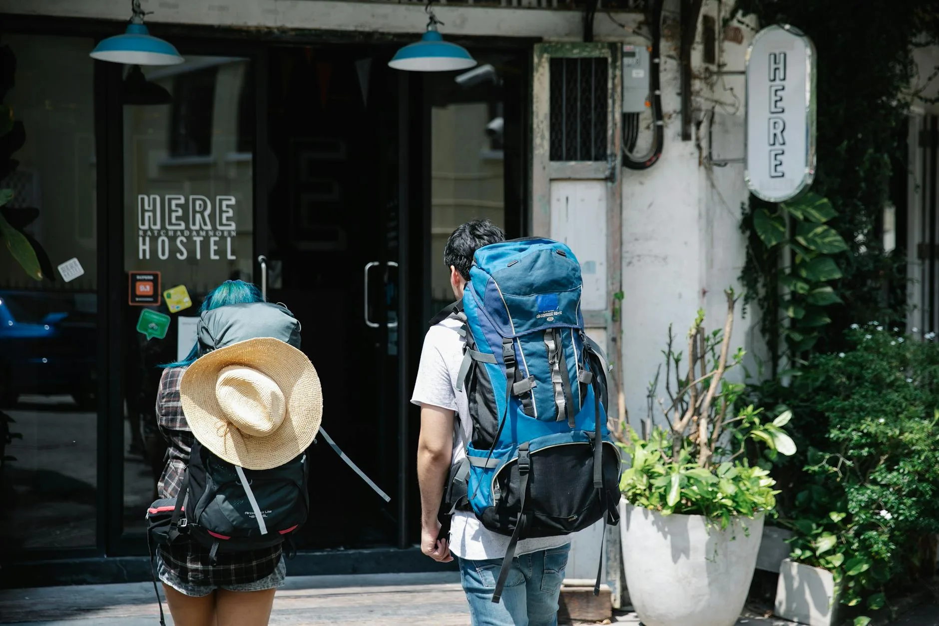 man and woman about to go inside a building